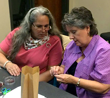 Two women in a classroom.