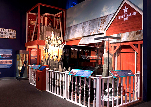 Part of an exhibit with a re-created building front of Foster-Harris Gin
