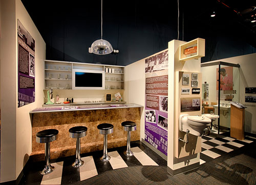Exhibit with stools at a re-created lunch counter.