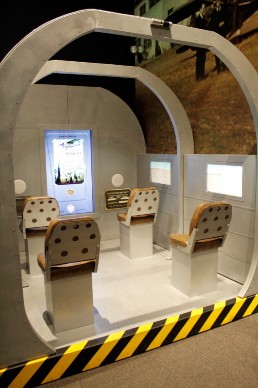 An exhibit that looks like four seats inside an airplane