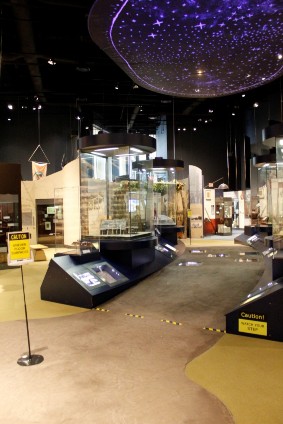 An exhibit about Native Americans featuring a star chart on the ceiling