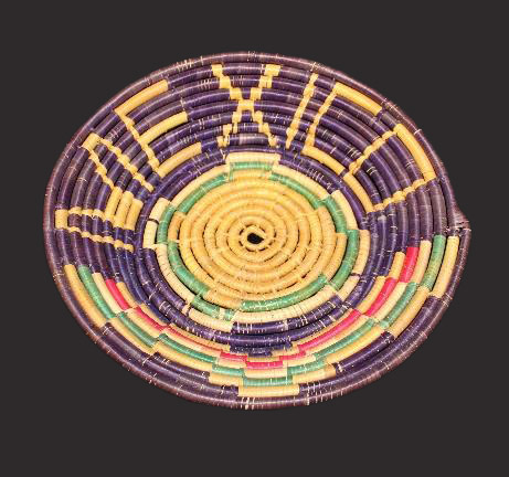 A short, bowl-shaped basket with the word Mexico in the design. 