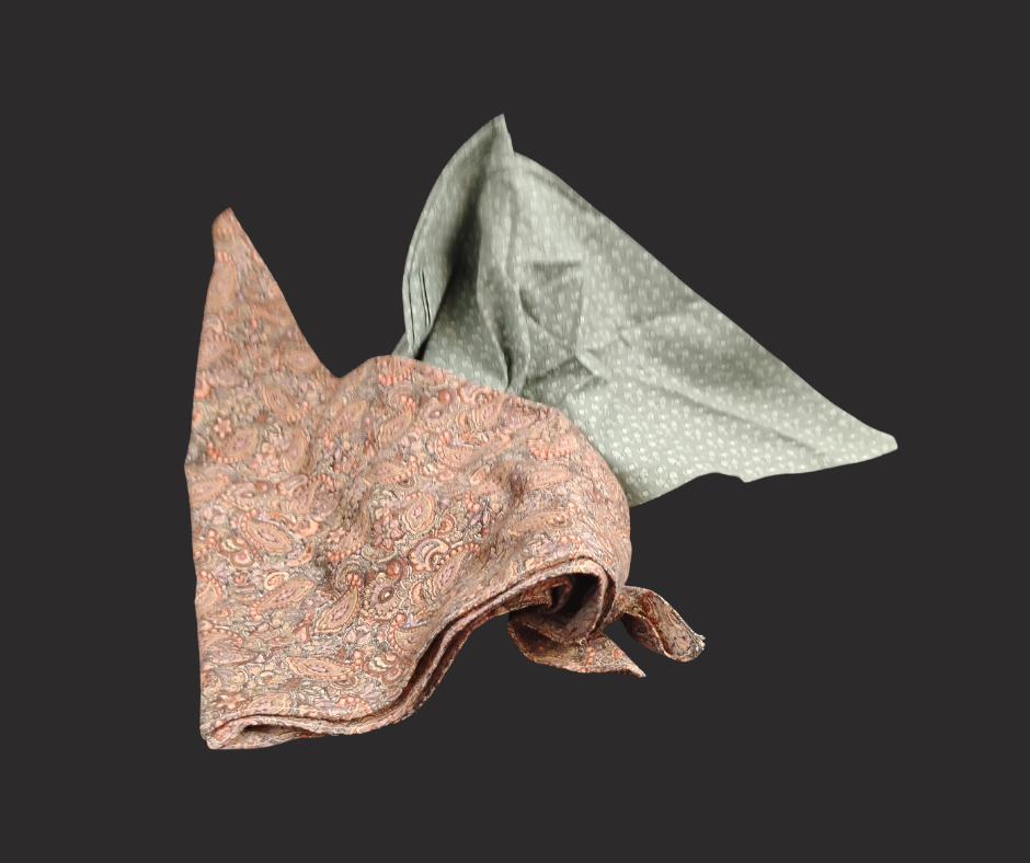 Two folded bandanas with small-print patterns.