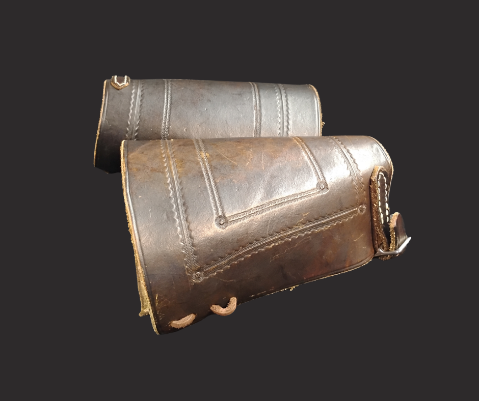 A set of leather cuffs protected wrists.